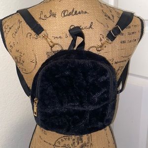 Small furry black backpack